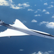 A render of a Boom supersonic jet flying in the sky.